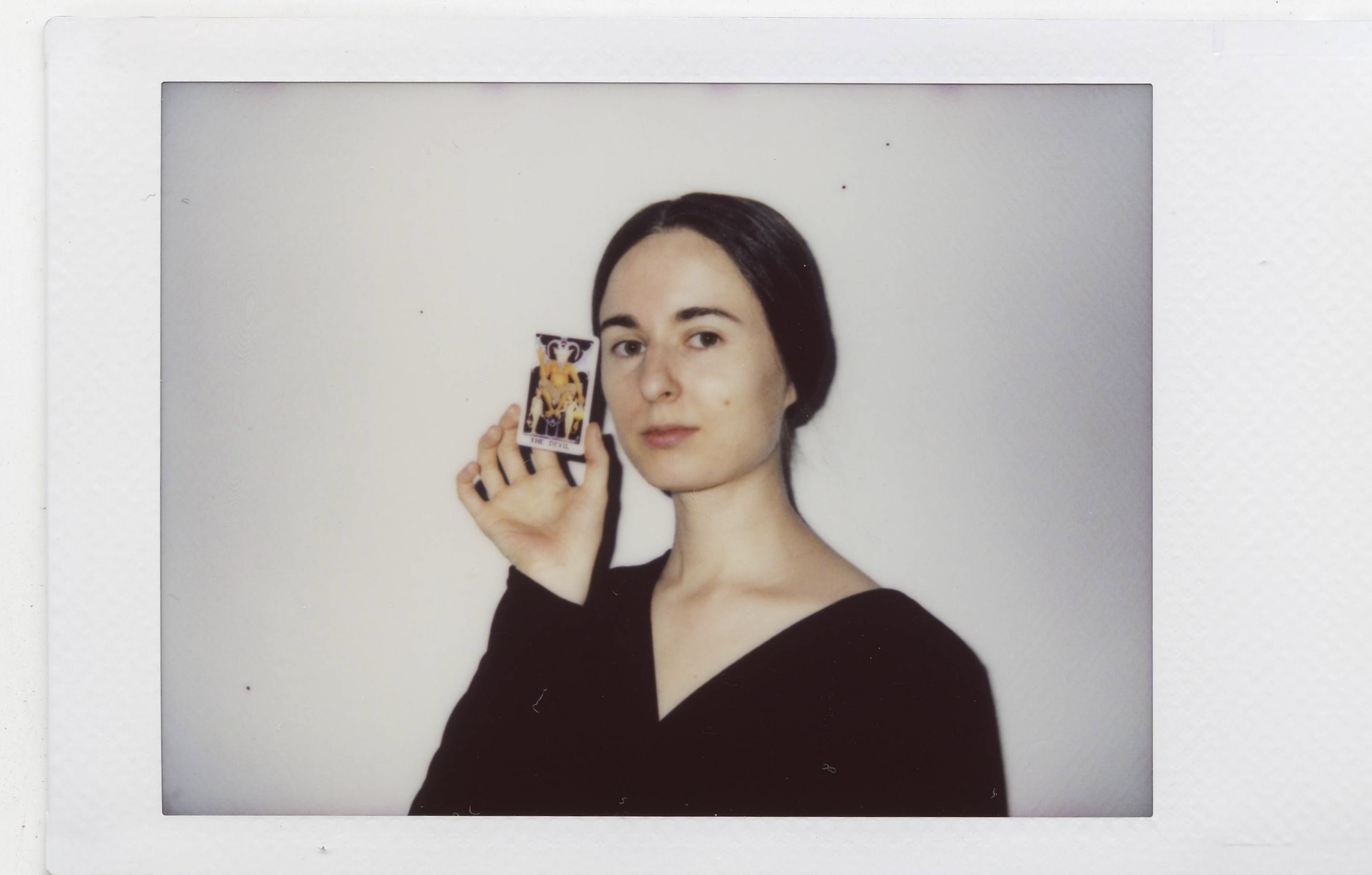 Tanya Fishmann, Liberation, 2021, instant analog portrait of a participant holding their Major Arcana Tarot card after the performance encounter