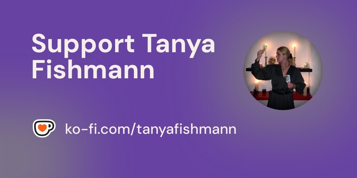 Hand arranging Tarot cards against a blue background, for Tanya Fishmann's mentoring and practice consultations for Tarot practitioners